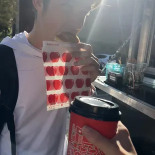 a man eating a donut