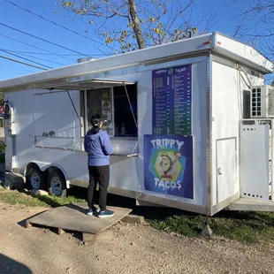 a man ordering food from a food truck
