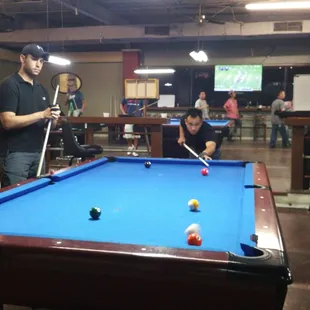 a man playing pool