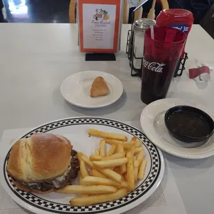 The Dip Into This sandwich with au jus, fries, and begnet