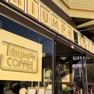 the entrance to a coffee shop