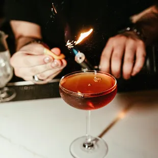 a person holding a lighter