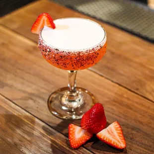 a cocktail with strawberries
