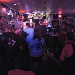 a group of people sitting at a bar