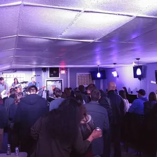 a large group of people at a bar