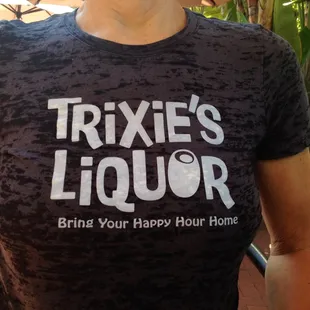 a man wearing a trixie&apos;s liquor t - shirt