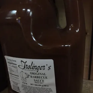 a gallon of brown liquid