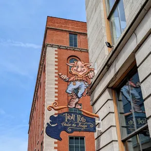 a sign for troll pub