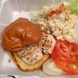 Chicken fillet sandwich with potato salad