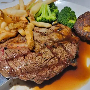 Ribeye steak, with a crab cake topper.
