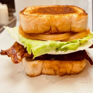 a bacon, lettuce, and cheese sandwich