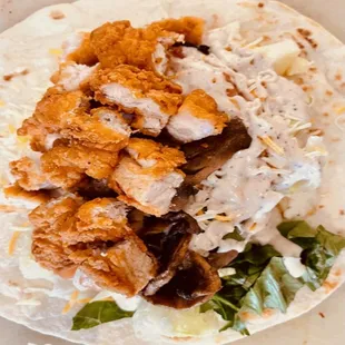 a chicken taco on a tortilla