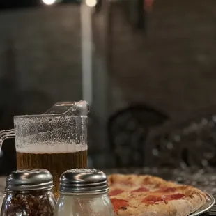 Pepperoni pizza and cold beverage