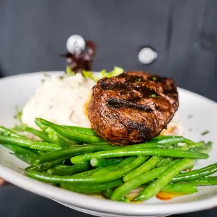 a man holding a plate of food