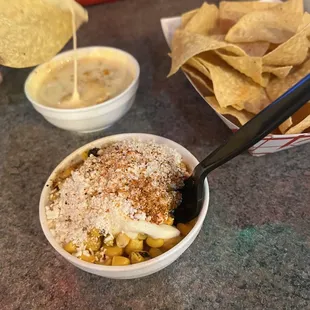 a bowl of corn and tortilla