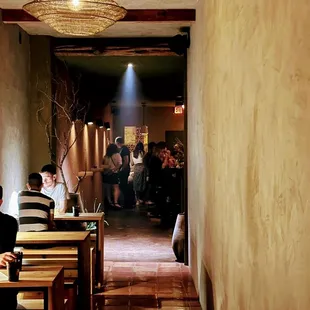 people sitting at tables in a restaurant