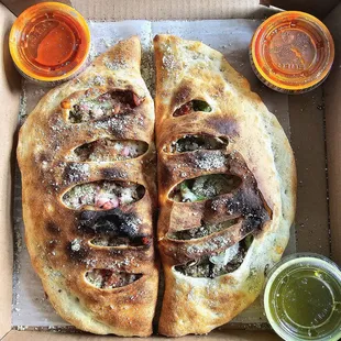 Left - Meat Lover Calzone Right - Deluxe Calzone