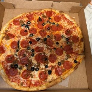 Cheese Pizza with pepperoni, black olives, and hamburger.