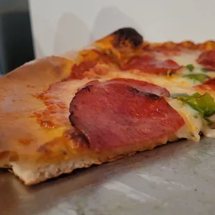 a slice of pepperoni pizza