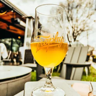 a glass of beer on a table