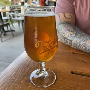 a glass of beer on a table