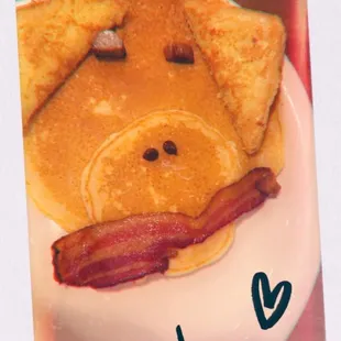 a plate of pancakes and bacon