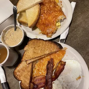 two plates of breakfast food and a cup of coffee