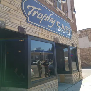 the reflection of a man in the window