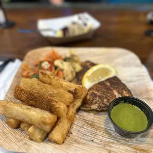 a plate of food with a side of dipping sauce