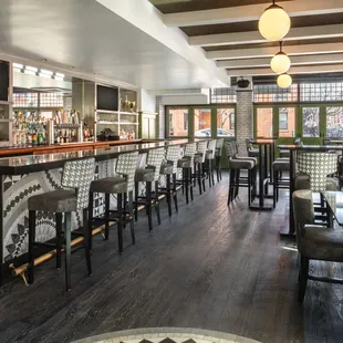 a bar with a lot of chairs