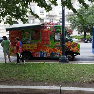 a food truck parked on the side of the road