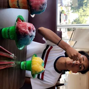 (left) large $5, and other two smalls $3 . huge portions not stingy with the flavored syrup at all !  many good flavors the choose from !!