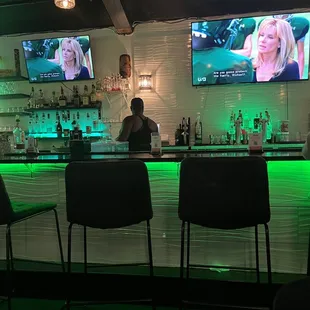 a woman sitting at a bar