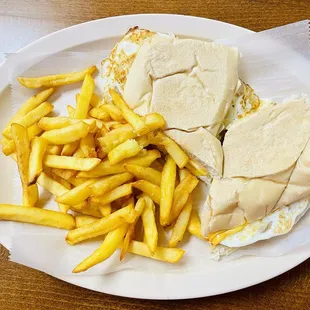 Egg and cheese sandwich with fries