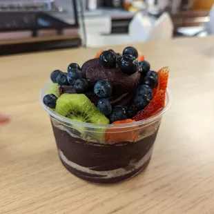 a dessert in a plastic cup