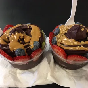 One topped with peanut butter and the other topped with cashew butter