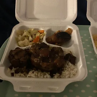 Ox tail, rice and peas, cabbage and beef Patty.
