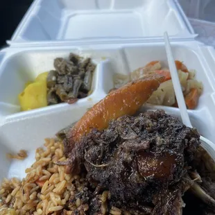 Oxtail, seasoned rice, cabbage, green beans, curried potato and chickpeas.