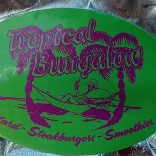 a green and purple sticker