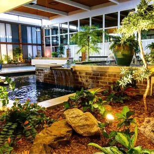 a waterfall in the center of the courtyard