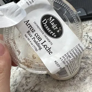 a person holding a container of food