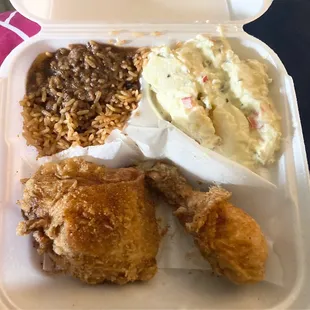 Dark meat fried chicken with rice and peas(oxtail gravy) and potato salad. Chicken juicy, rice and salad just okay.