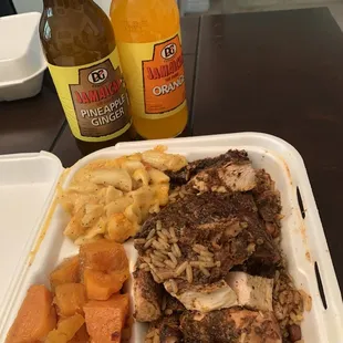 Jerk chicken with Mac and cheese / yams. Jamaican drinks