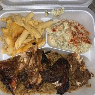 Jerk chicken with mac &amp; cheese and potato salad.