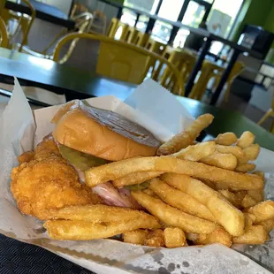 a sandwich and french fries in a basket
