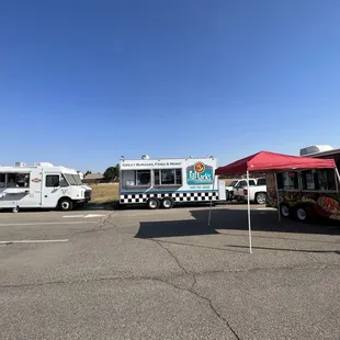 food trucks lined up in a parking lot
