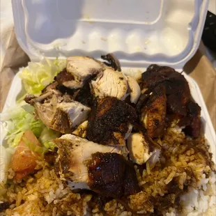 Medium jerk chicken meal with white rice and oxtail gravy and salad