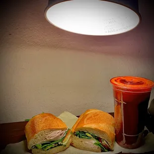 a sandwich and a drink on a table