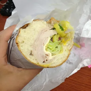 Half of the turkey and cheese sub sandwich.