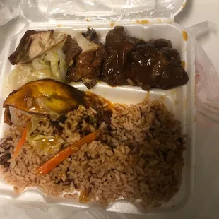 rice, meat, and vegetables in a styrofoam container